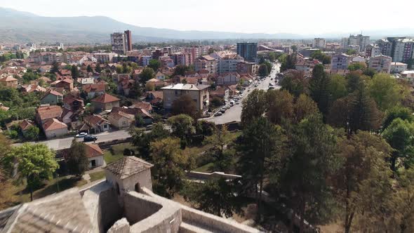 Small medieval fortress in Pirot, Serbia. Town behind drone shot 2