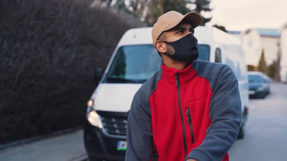 Man with Face Mask Delivering Package alt