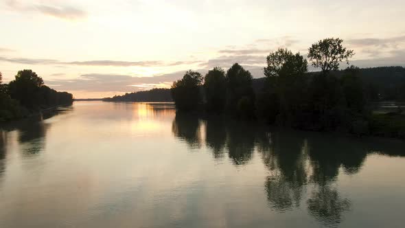 View of Fraser River. Colorful Summer Sunset. East of Vancouver, British Columbia, Canada. alt