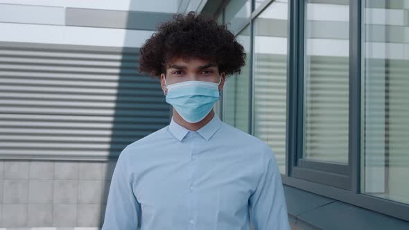 African Black Man Putting on Outbreak Mask Prevention Young Man Wearing Covid Mask alt