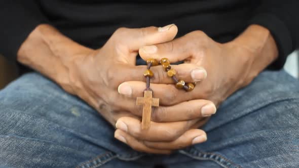 man sitting praying to god in silence with hands together stock video alt