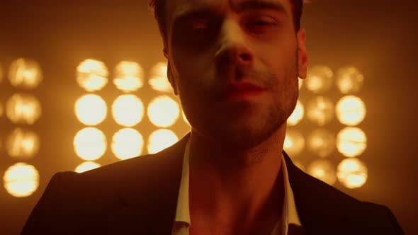 Man Looking Camera Seductive in Club Lights Closeup alt