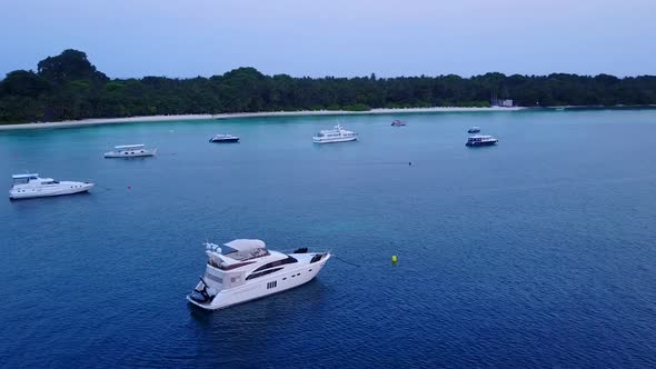 Aerial drone texture of lagoon beach by blue ocean with sand background alt