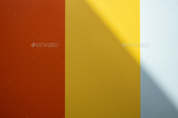 Background of red, yellow and gray colors with shadow. Colored vertical ...