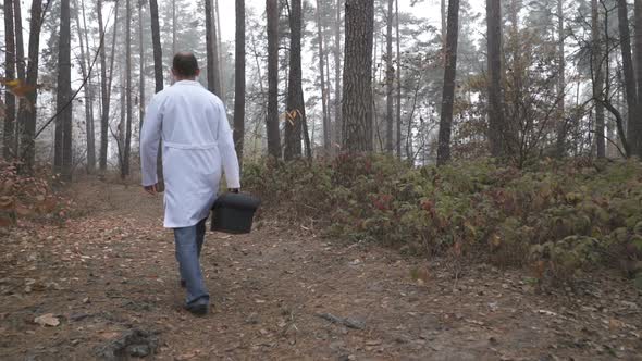 Environmental Scientist Walking Through the Forest