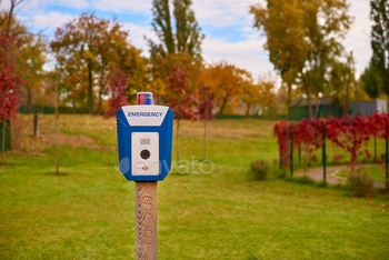 Panic alarm for call to police, emergency button in public park. Blue box with video camera
