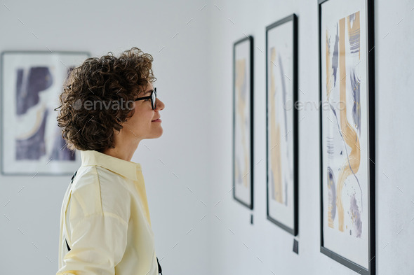 Young woman visiting art gallery