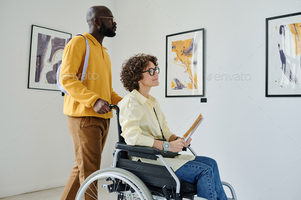 Woman with disability enjoying modern art