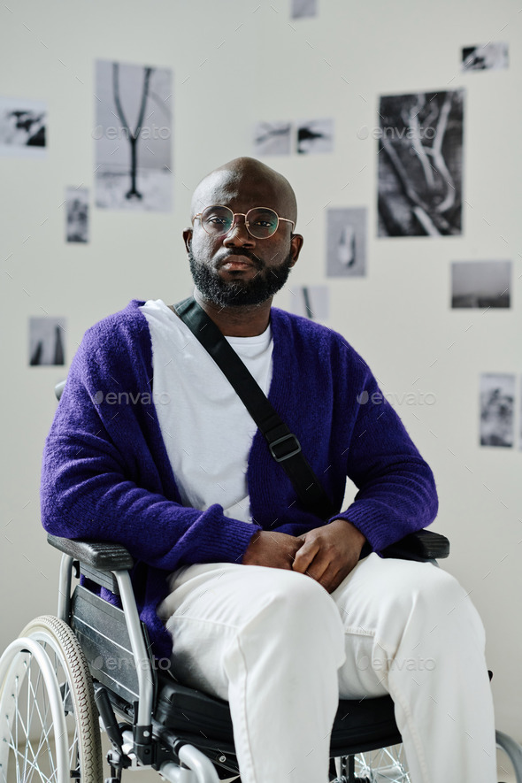 African man with disability visiting gallery of modern art