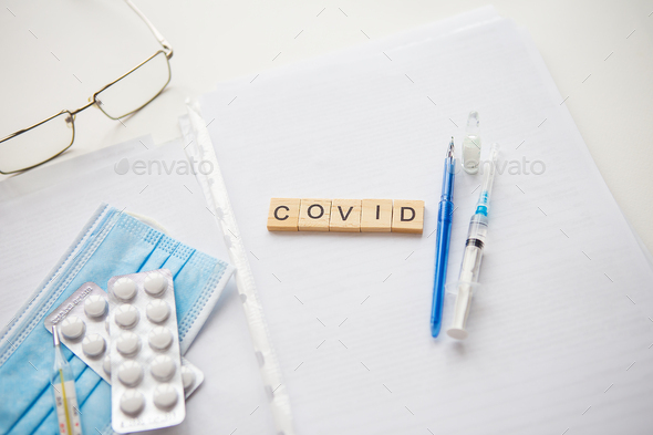 Preparation for vaccination. Coronavirus, covid-19 vaccination. Covid inscription. Doctor\'s desk.