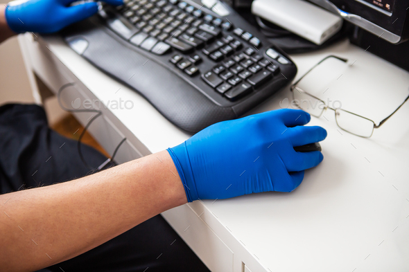 A doctor in blue gloves quickly collects data about a patient. The concept of healthcare