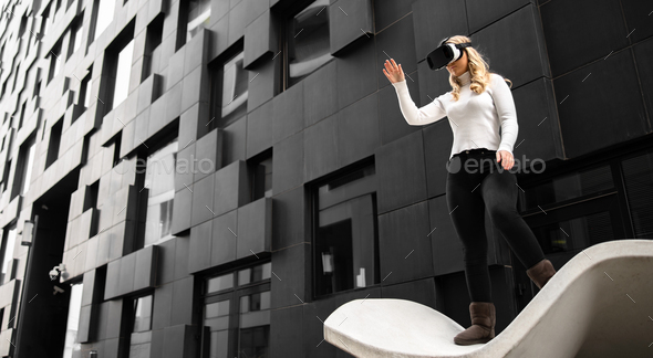 Environmental Portrait of Woman Using Virtual Reality Glasses and Shoping In Metaverse Business - Stock Photo - Images