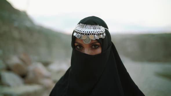 Face with Jewelry of Attractive Muslim Gir Wearing Traditional Hijab Scarf alt