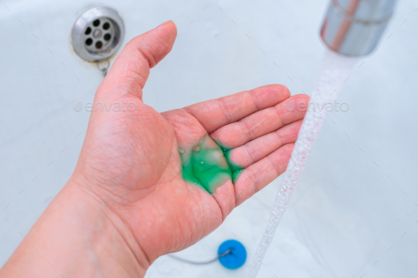 Taking care of personal hygiene with liquid soap or shampoo