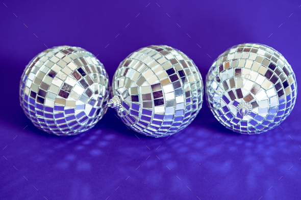 Sparkling disco ball in a day light. Concept of party. Stock Photo by  FabrikaPhoto