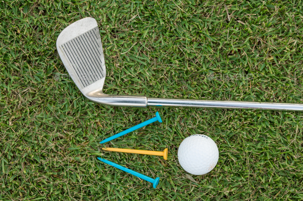 Golf Ball and Golf Club on grass - Stock Photo - Images