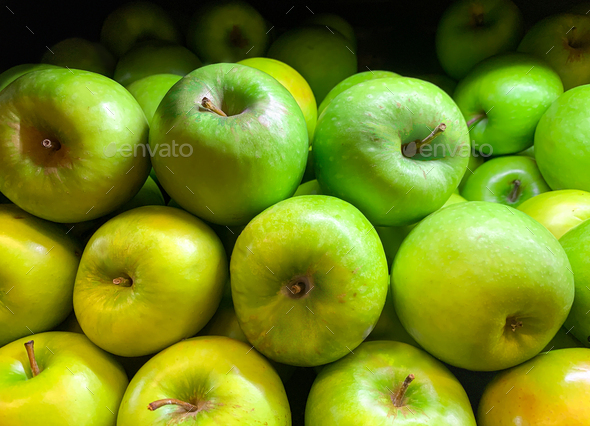 Green juicy organic Granny Smith Apples. Raw fruit background. Front view.  Close up. Stock Photo by poetique_id