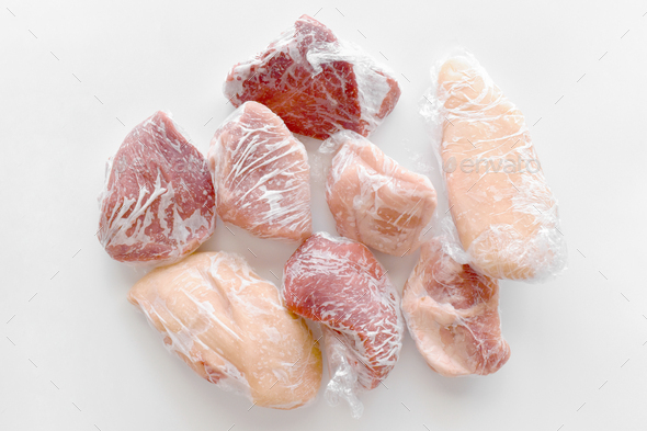 Frozen meat in cling film or plastic wrap.