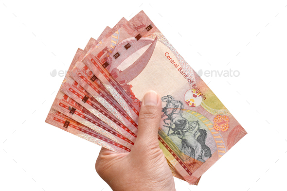 One dinar of Bahrain banknotes in hand. - Stock Photo - Images