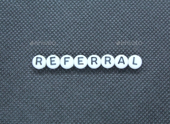 the word referral on a black and white circle.