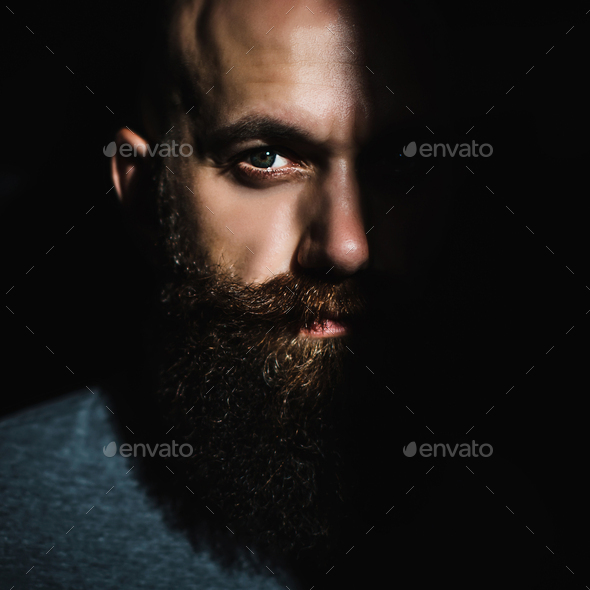 Close-up Portrait Of Middle Aged Brutal Bearded Man With Expressive 