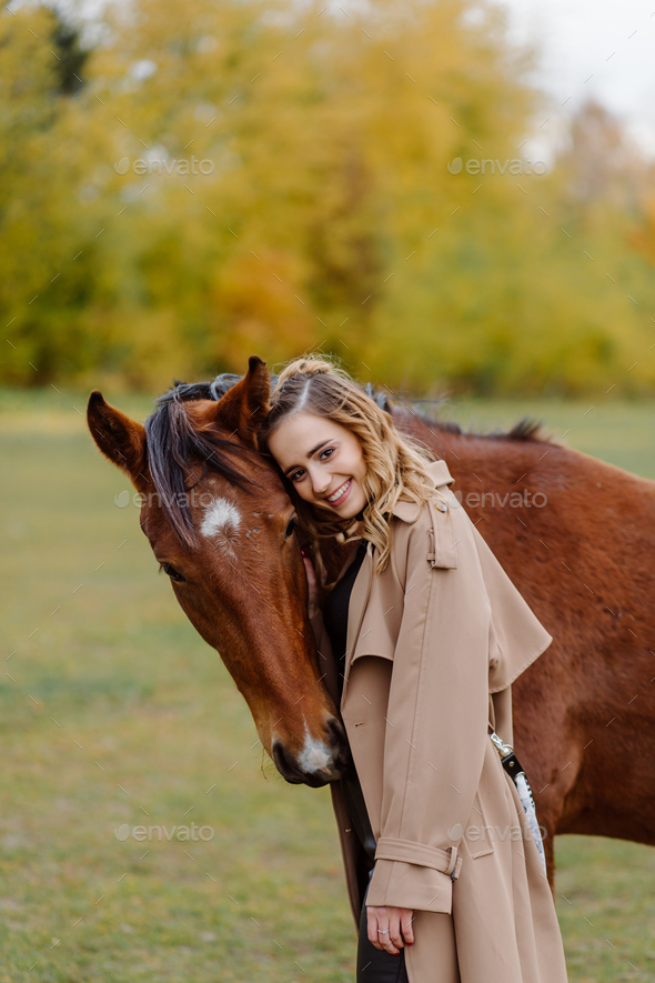 Woman on a horse at rancho. Horse riding, hobby time. Concept of animals and human - Stock Photo - Images