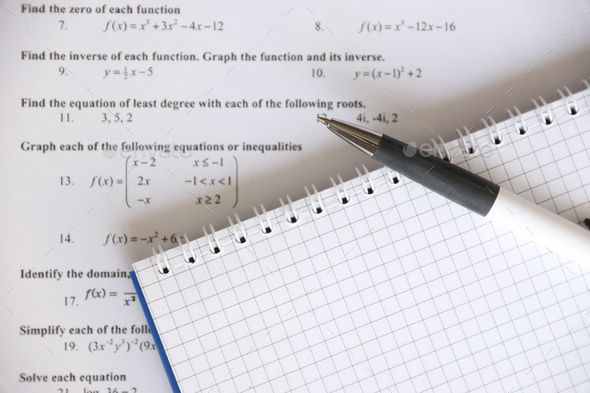 Handwriting of mathematics quadratic equation on examination, practice, quiz or test in maths class