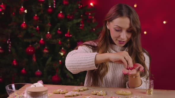 Cheerful Woman Making Christmas Ginger Cookies in Cozy New Year's Eve Atmosphere