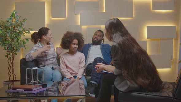 Multiracial Family and Little Daughter with Mental Problems Visiting Counselor alt