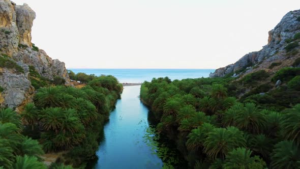 Aerial View of Canyon River Flowing to Sea in Crete Preveli Beach in Greece