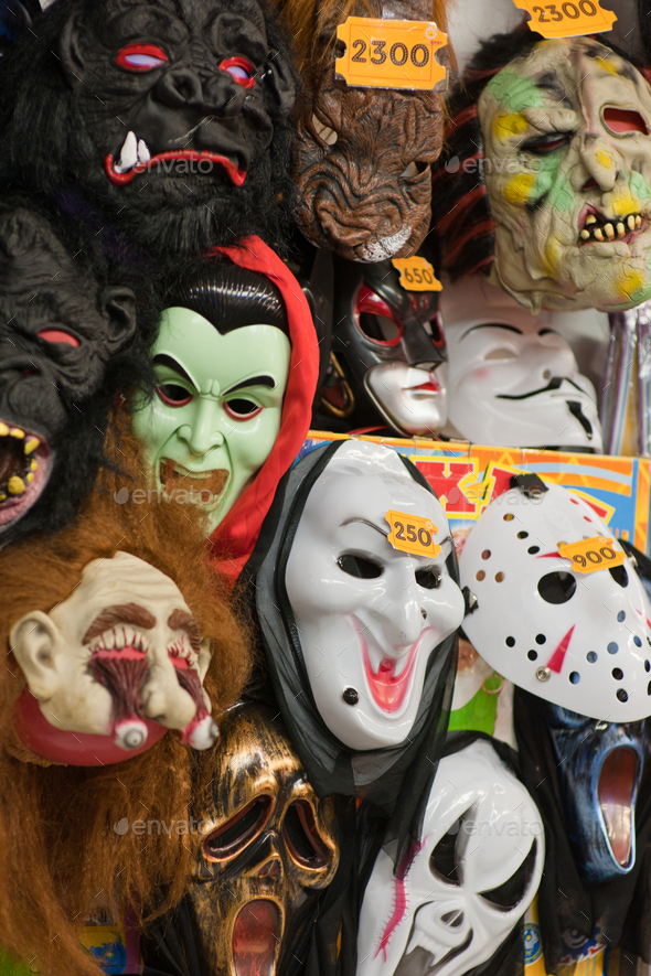 Display wall of halloween scary masks on sale in joke shop Stock Photo by Lelia_Milaya