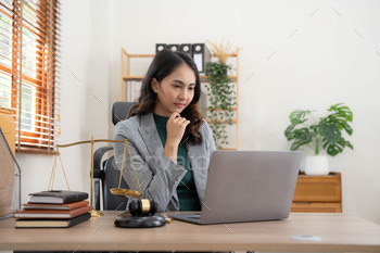 Asian business lawyer woman working with computer laptop in legal office.Law and Legal services