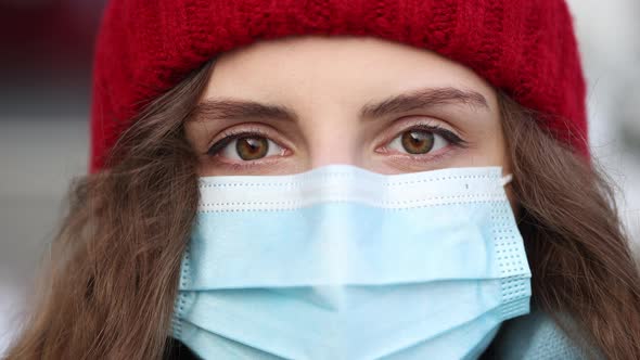 Close up Face Serious Woman Wears Protective Mask to Avoid Contaminating Coronavirus Looks of City 