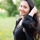 Portrait of smiling young woman with dark clothing. - PhotoDune Item for Sale