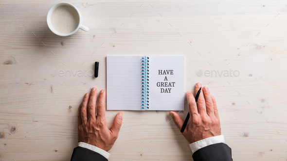 open notepad with Have a great day written in it