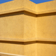 Yellow building wall against the blue sky. - PhotoDune Item for Sale