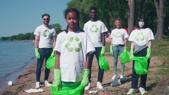 Group of Eco Activists Fighting for the Preservation of Nature African Girl in the Foreground alt