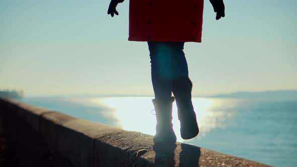 Traveler Feet Wearing Jeans And Winter Shoes Walking.Traveler Legs On Casual Boots. Cold Winter Day. alt