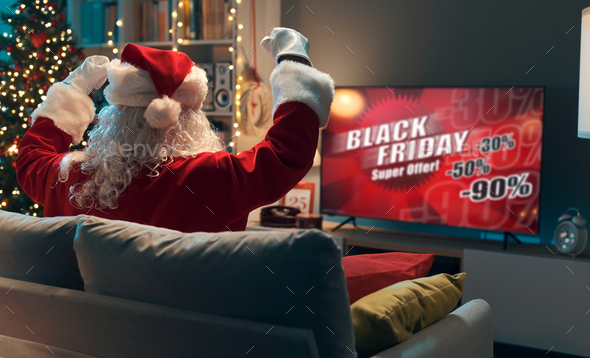 Santa watching a Black Friday TV commercial