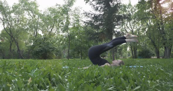 Beautiful Woman Doing Pilates in the Green Park