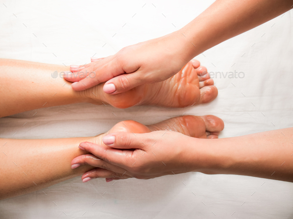 foot soles massage, top view, close-up