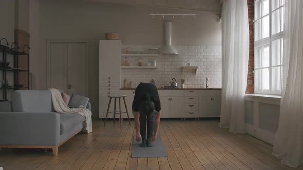 Man Practicing Yoga at home