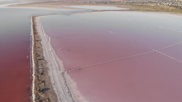 Old wooden piles in salt water on Kuyalnik estuary. Wooden structures, salt extraction  alt