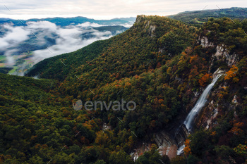 dawns in the valley of the waterfall in autumn