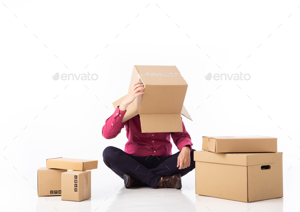 man cover his head with cardboard and confused on courier parcels.