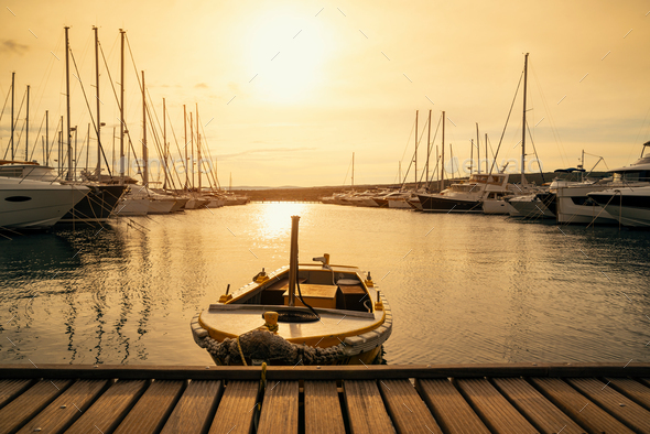 Boat at sunset in Adriatic sea - Stock Photo - Images