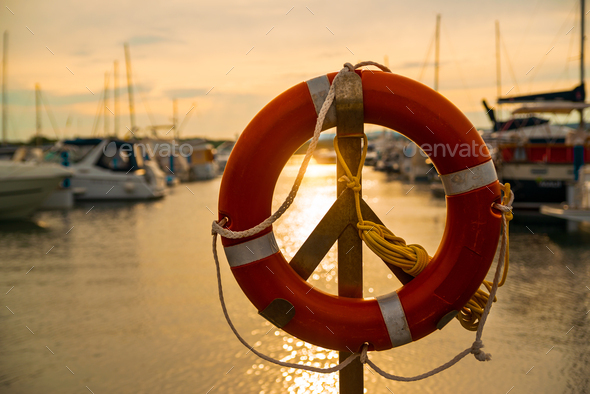 Life buoy in sunset - Stock Photo - Images