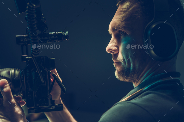 Videographer Camera Operator with Professional Digital Recording Device in Hands