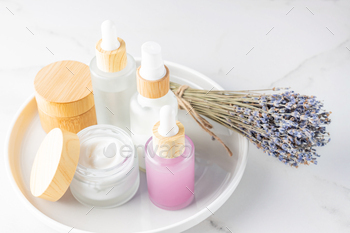 Lavender beauty products - dropper bottles with lavender cosmetic oil or essential oil and handmade 