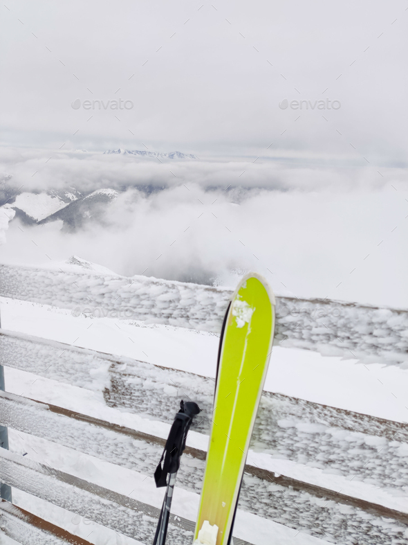 ski stick in snow mountains on background
